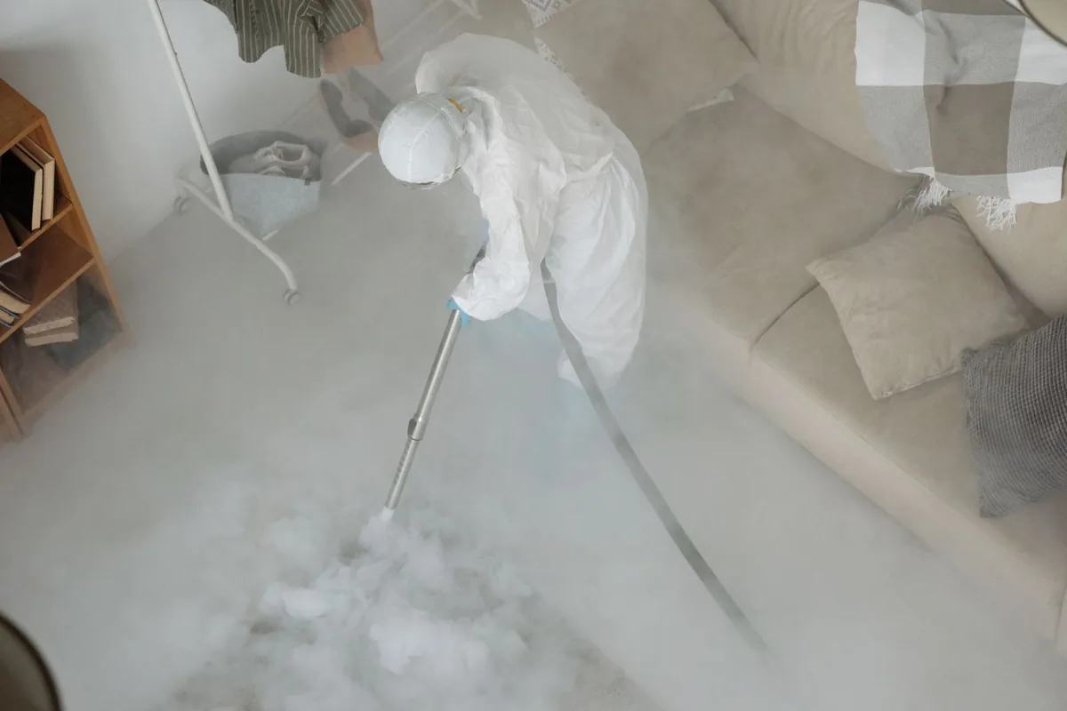 Biohazard cleanup technician in protective equipment, Putney, GA